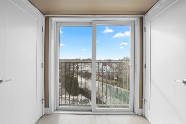 a view of a glass door and a window