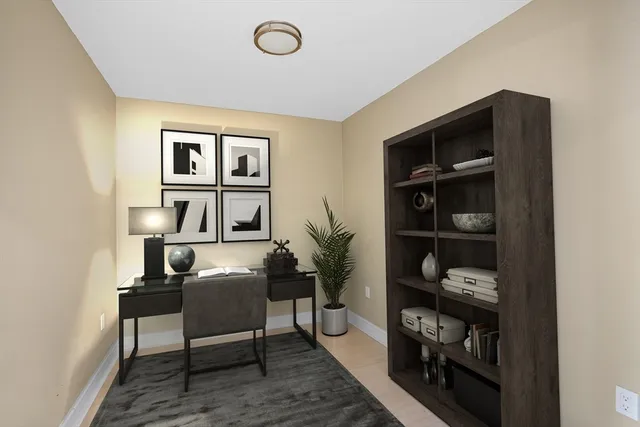 a workspace room with furniture and wooden floor