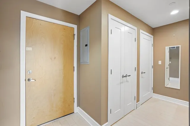 a view of a hallway with closet area