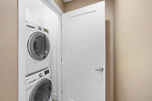 a view of a hallway with washer and dryer
