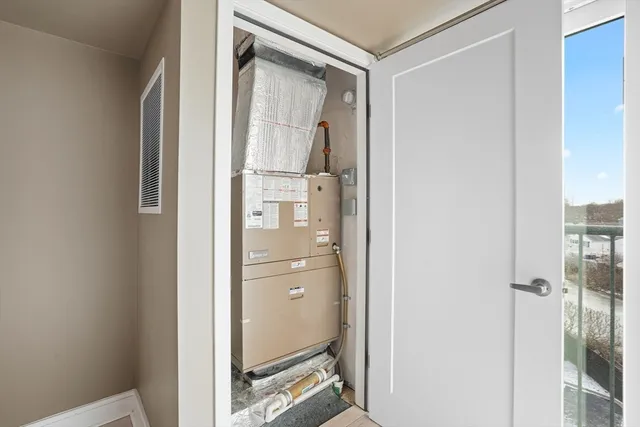 a bathroom with a glass shower door and a glass door