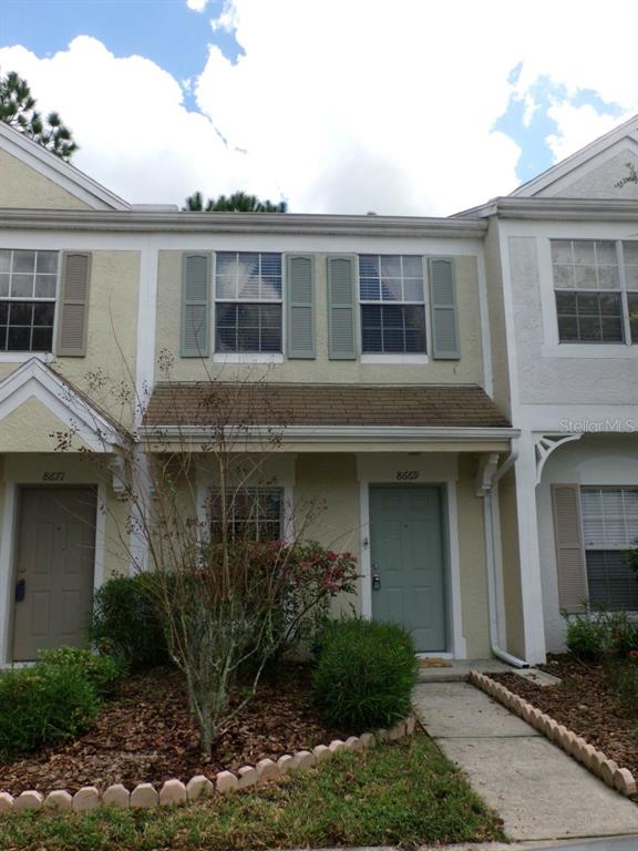 8669 Hunters Key Circle Tampa, FL 33647 - Photo 1 of 1 a front view of a house with garden
