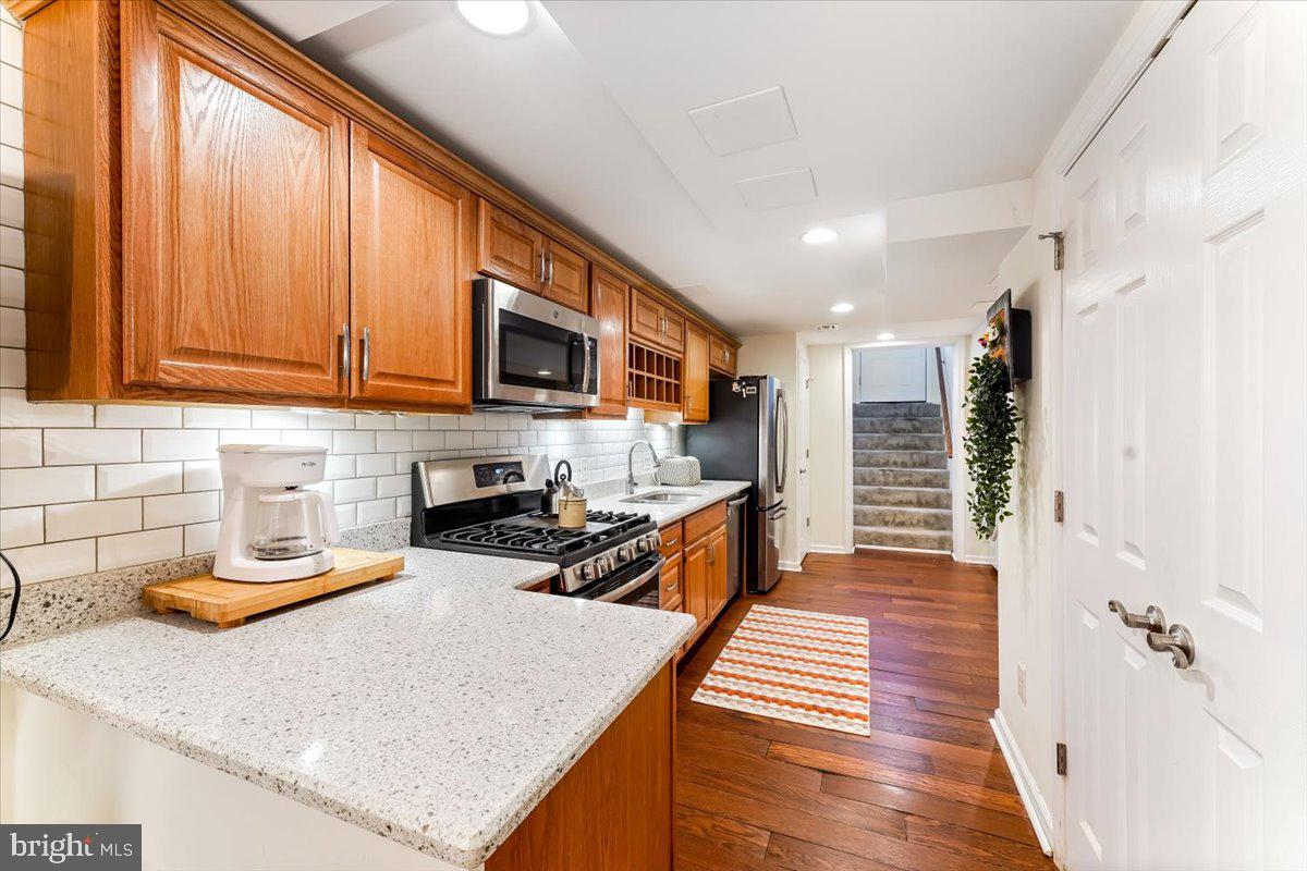 43 North Hawthorne Road, Unit LL Coatesville, PA 19320 - Photo 14 of 27 a kitchen with sink refrigerator and microwave