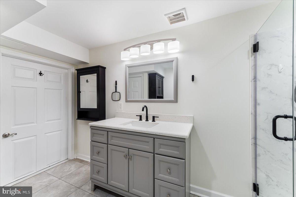 43 North Hawthorne Road, Unit LL Coatesville, PA 19320 - Photo 22 of 27 a bathroom with a sink vanity and a mirror