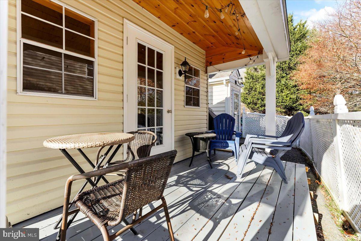 43 North Hawthorne Road, Unit LL Coatesville, PA 19320 - Photo 23 of 27 a view of a patio with table and chairs and wooden floor