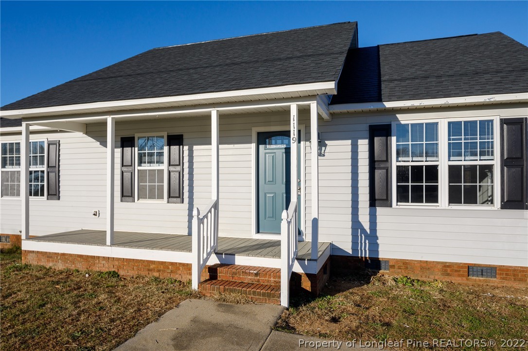 1119 Live Oak Road Coats, NC 27521 - Photo 3 of 23 a front view of a house