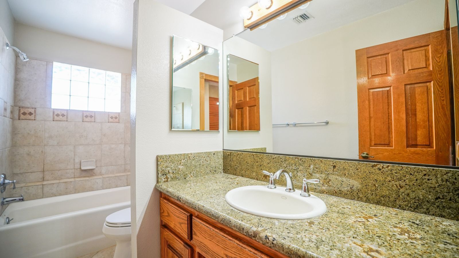 948 Hermosa Avenue Ridgecrest, CA 93555 - Photo 34 of 46 a bathroom with a granite countertop sink toilet and shower