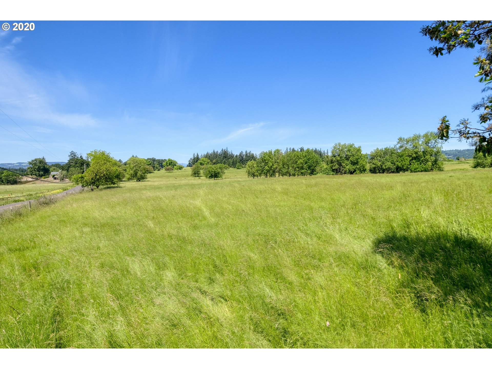 30575 Northeast Fernwood Road Newberg, OR 97132 - Photo 8 of 20 a view of a lake and a yard