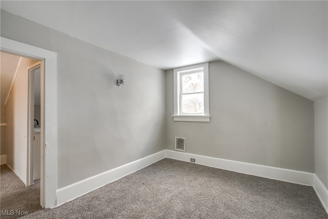 46 Rosenberry Street Alliance, OH 44601 - Photo 28 of 39 Bonus room featuring lofted ceiling and carpet floors