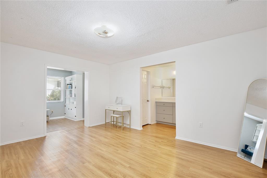 1179 Shadow Run Drive Lakeland, FL 33813 - Photo 13 of 42 a view of empty room with wooden floor and cabinet