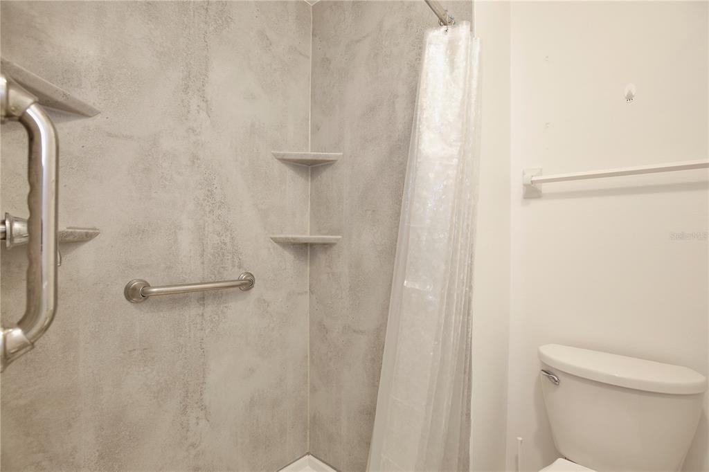 1179 Shadow Run Drive Lakeland, FL 33813 - Photo 17 of 42 a bathroom with a shower and a toilet