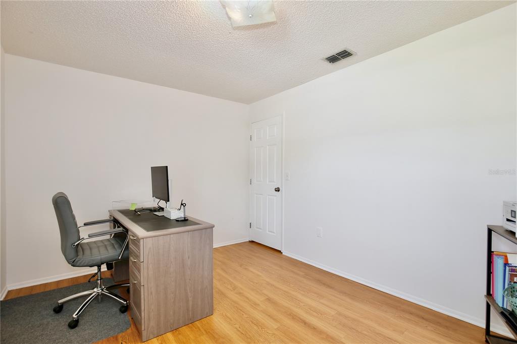 1179 Shadow Run Drive Lakeland, FL 33813 - Photo 23 of 42 a view of workspace with wooden floor and a sink