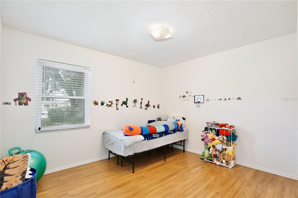 1179 Shadow Run Drive Lakeland, FL 33813 - Photo 25 of 42 a bed room with a bed and a window