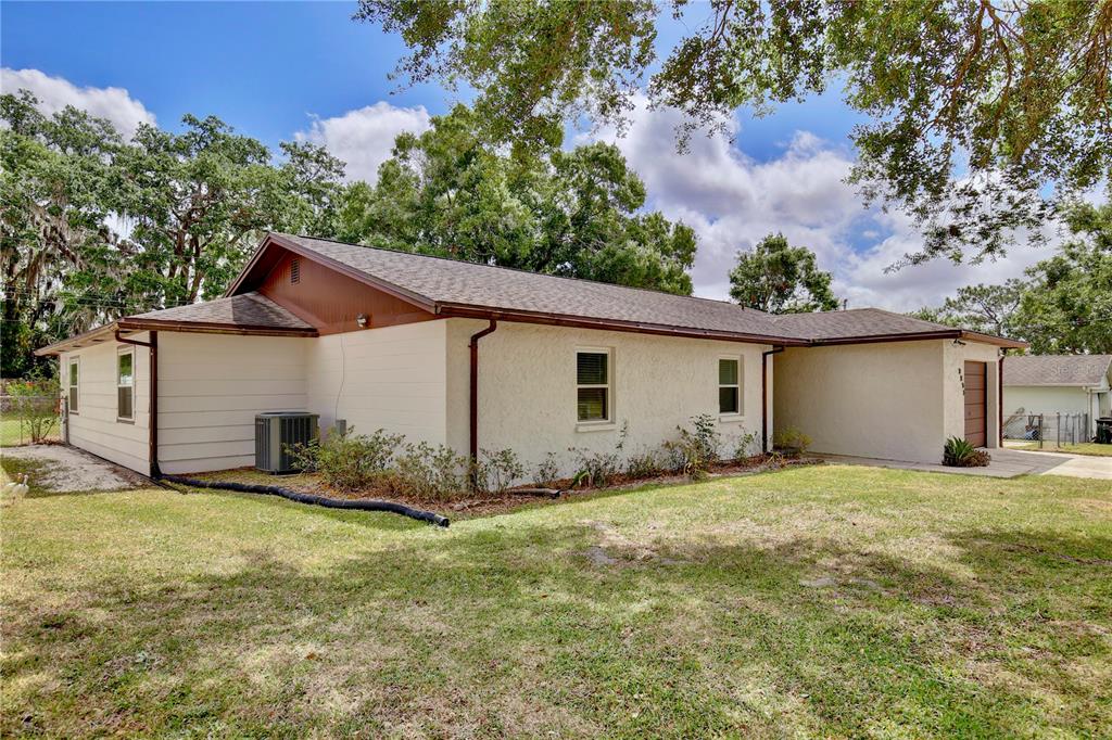 1179 Shadow Run Drive Lakeland, FL 33813 - Photo 3 of 42 a view of a house with yard and a tree
