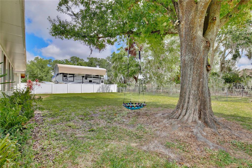 1179 Shadow Run Drive Lakeland, FL 33813 - Photo 33 of 42 a view of a swimming pool with a yard