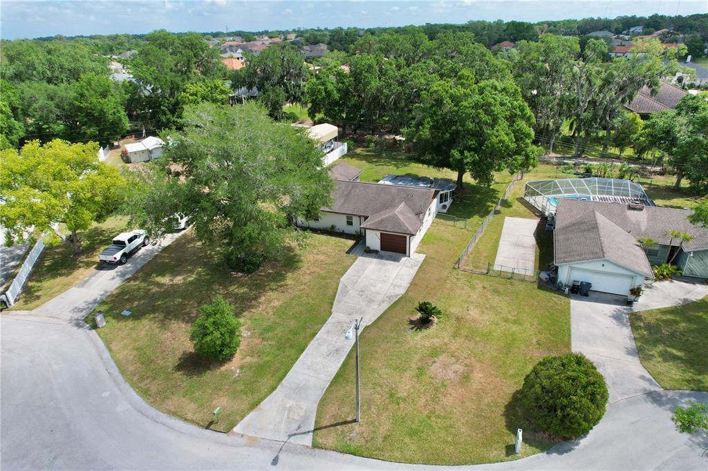 1179 Shadow Run Drive Lakeland, FL 33813 - Photo 36 of 42 an aerial view of a house with a yard and trees all around