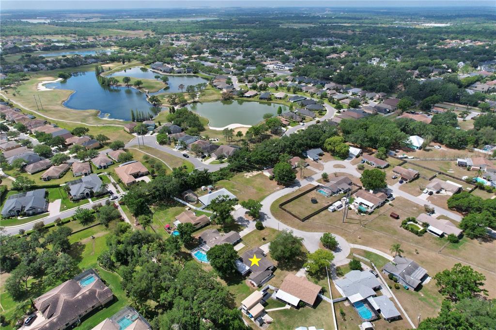 1179 Shadow Run Drive Lakeland, FL 33813 - Photo 39 of 42 an aerial view of residential houses with outdoor space