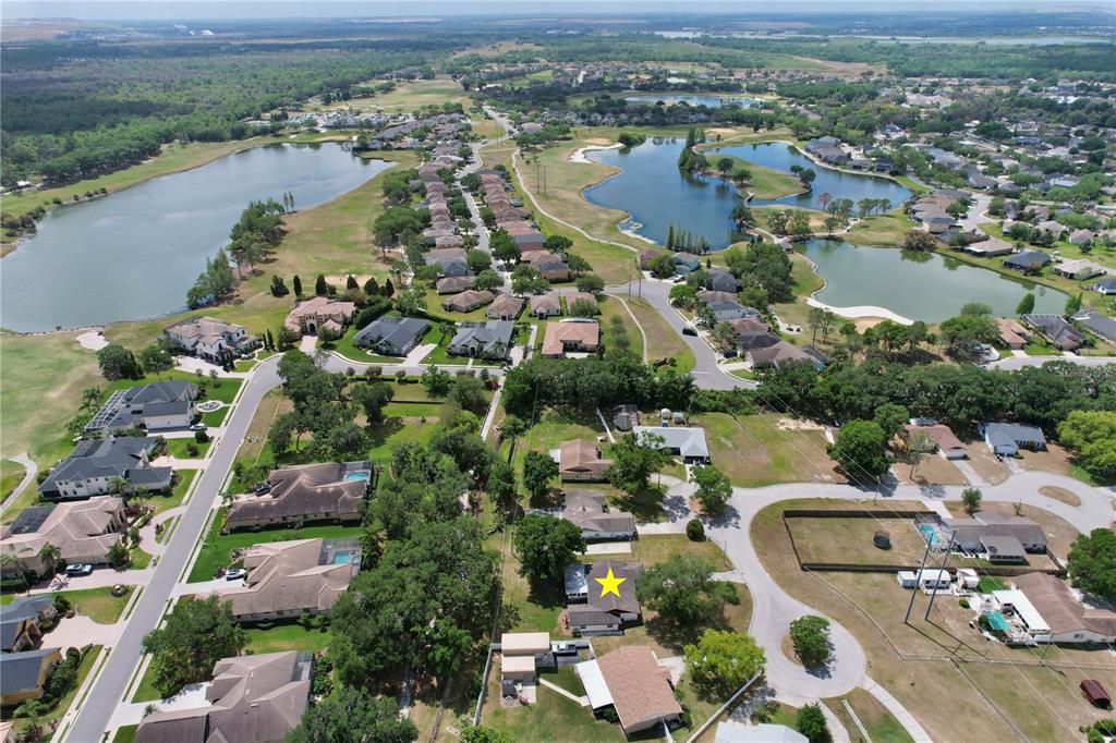 1179 Shadow Run Drive Lakeland, FL 33813 - Photo 40 of 42 an aerial view of lake residential houses with outdoor space and lake view