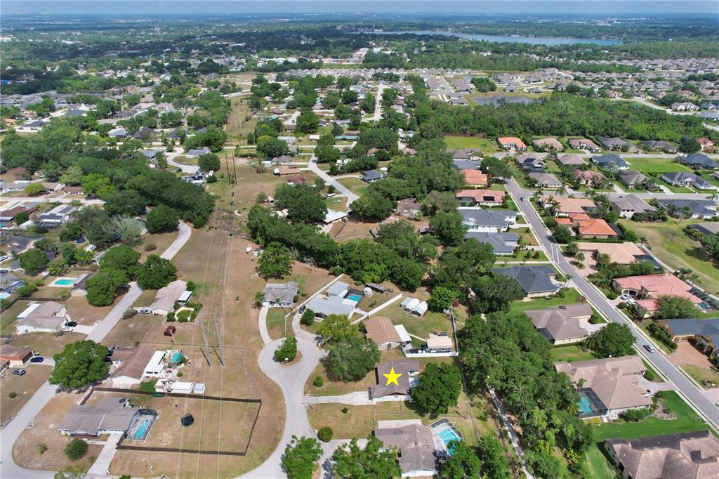 1179 Shadow Run Drive Lakeland, FL 33813 - Photo 42 of 42 an aerial view of residential houses with outdoor space