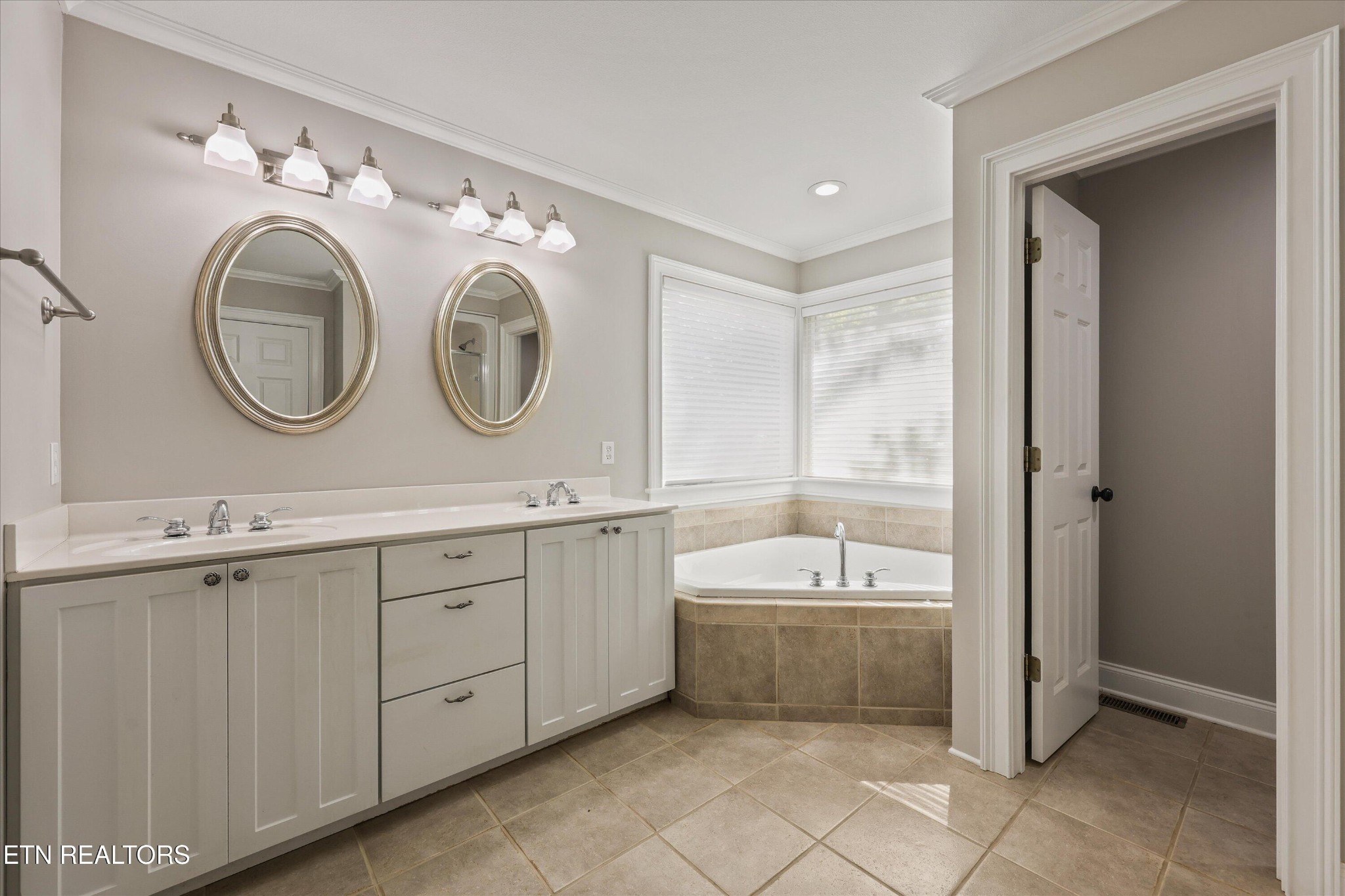 865 Stonegate Way Townsend, TN 37882 - Photo 15 of 60 a spacious bathroom with a double vanity sink mirror and bathtub