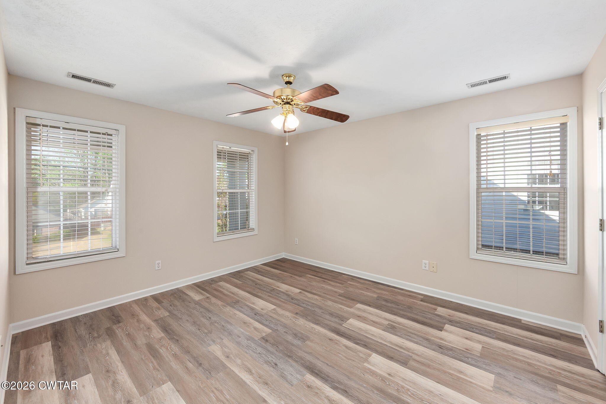 8 Sebastian Drive Jackson, TN 38305 - Photo 11 of 23 a view of an empty room with a window and a chandelier fan