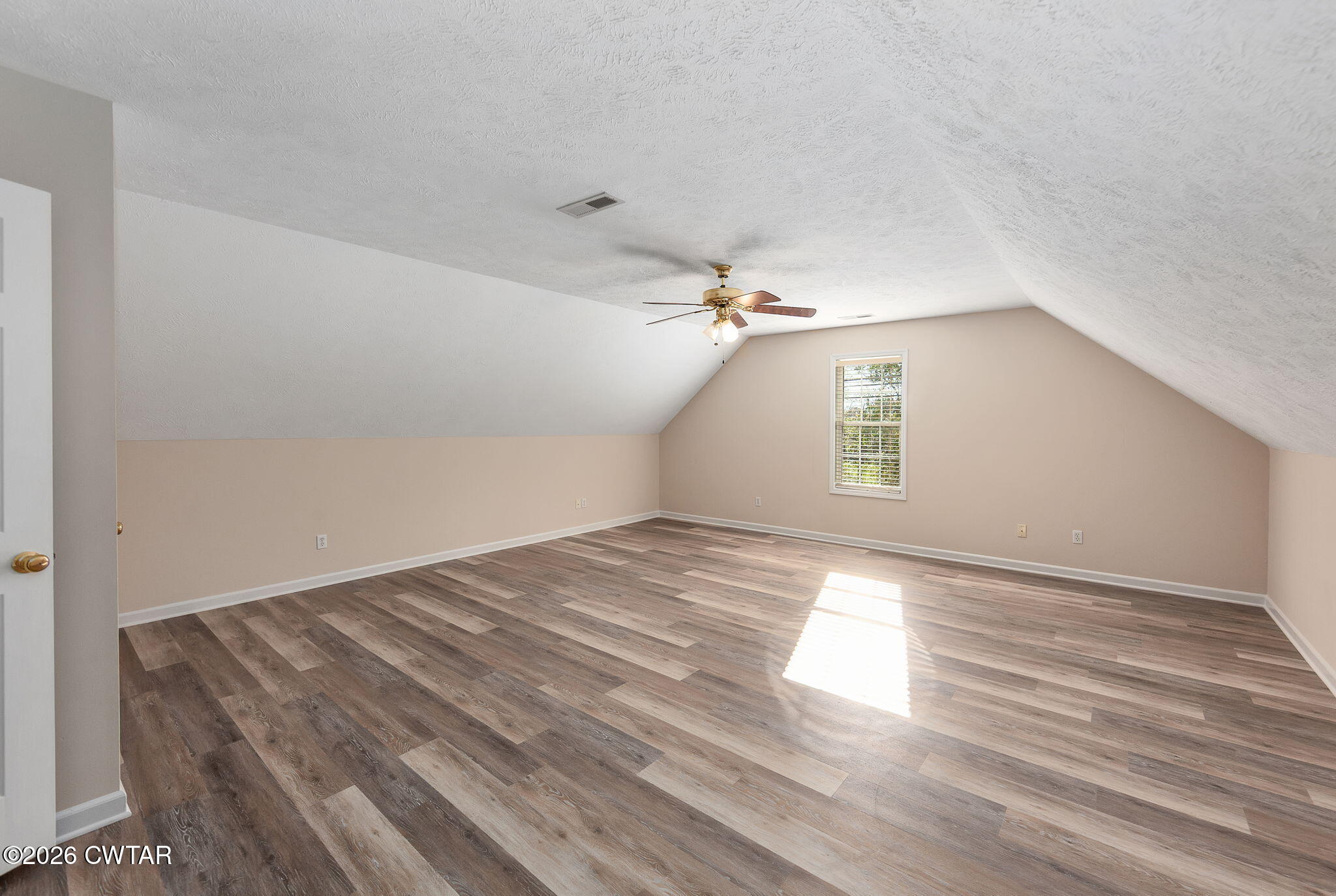 8 Sebastian Drive Jackson, TN 38305 - Photo 15 of 23 an empty room with wooden floor and windows