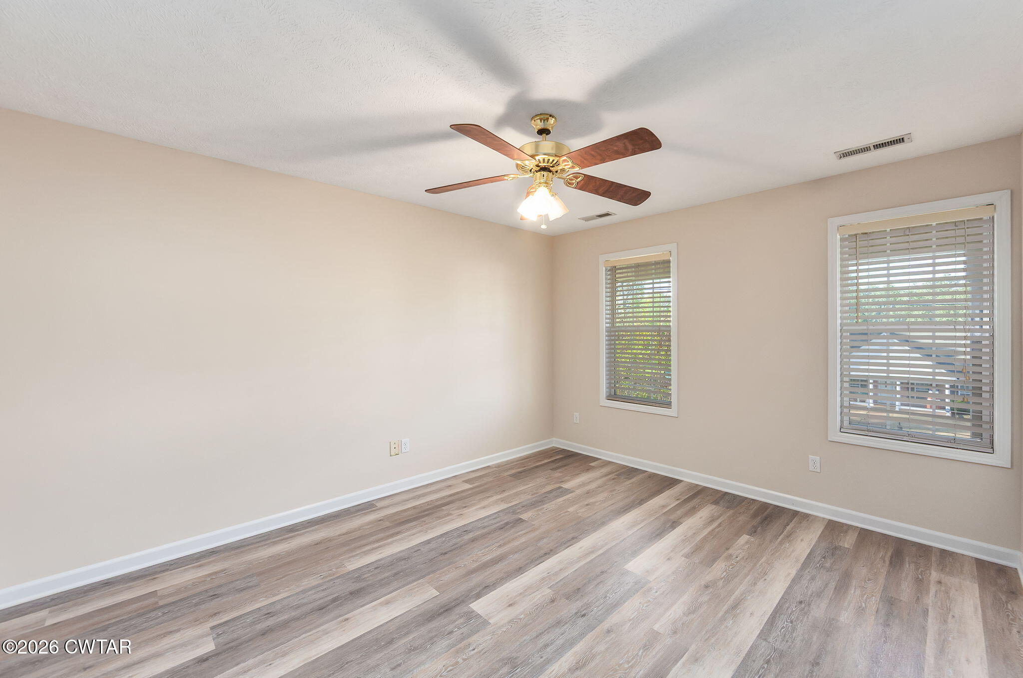 8 Sebastian Drive Jackson, TN 38305 - Photo 19 of 23 wooden floor in an empty room with a window