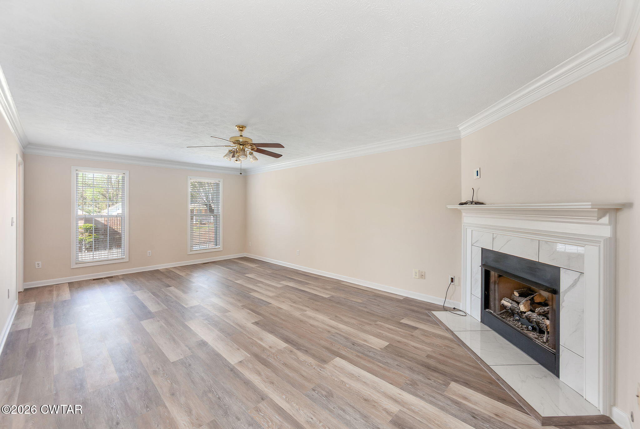 8 Sebastian Drive Jackson, TN 38305 - Photo 2 of 23 an empty room with windows and fireplace