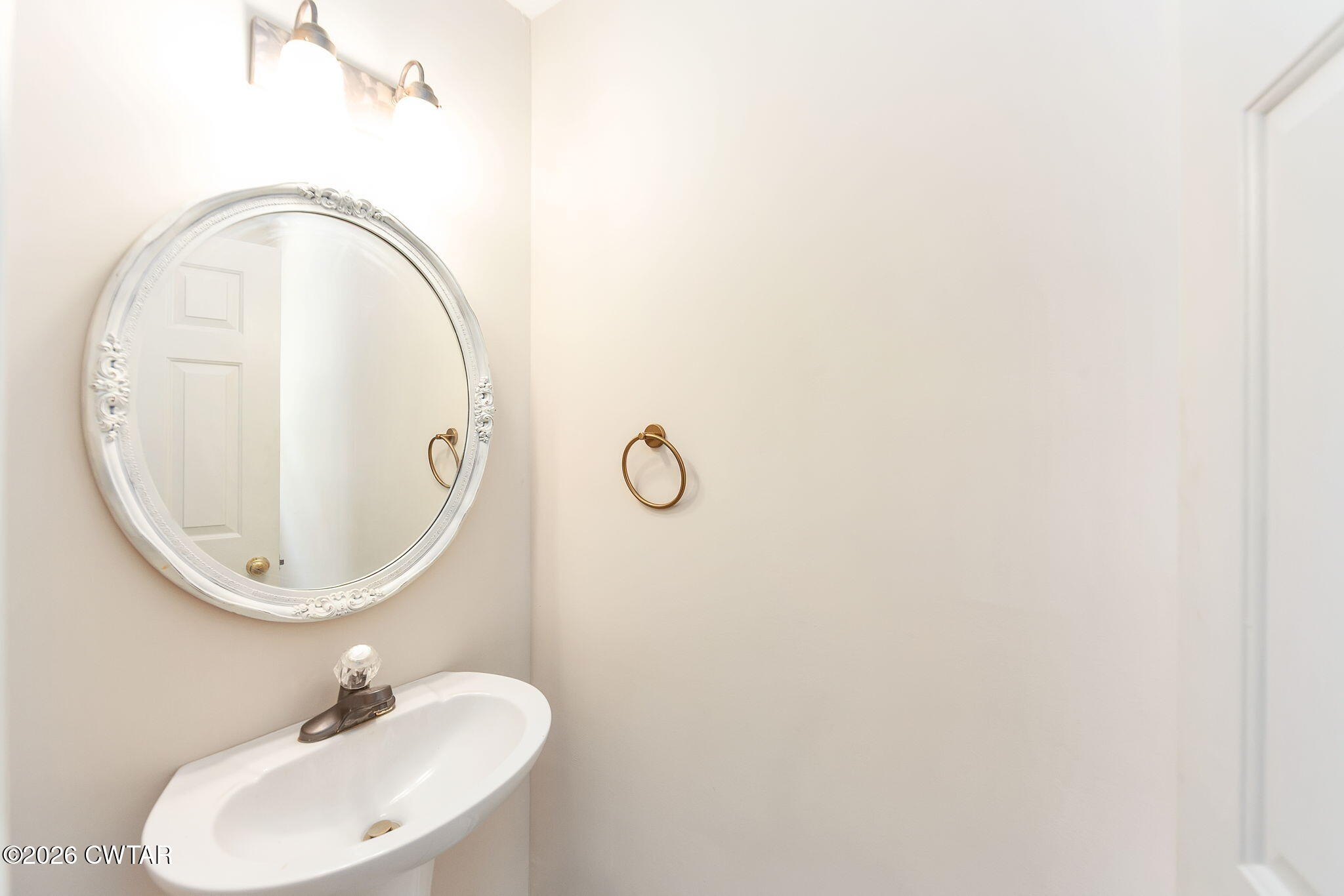 8 Sebastian Drive Jackson, TN 38305 - Photo 22 of 23 a bathroom with a sink and a mirror