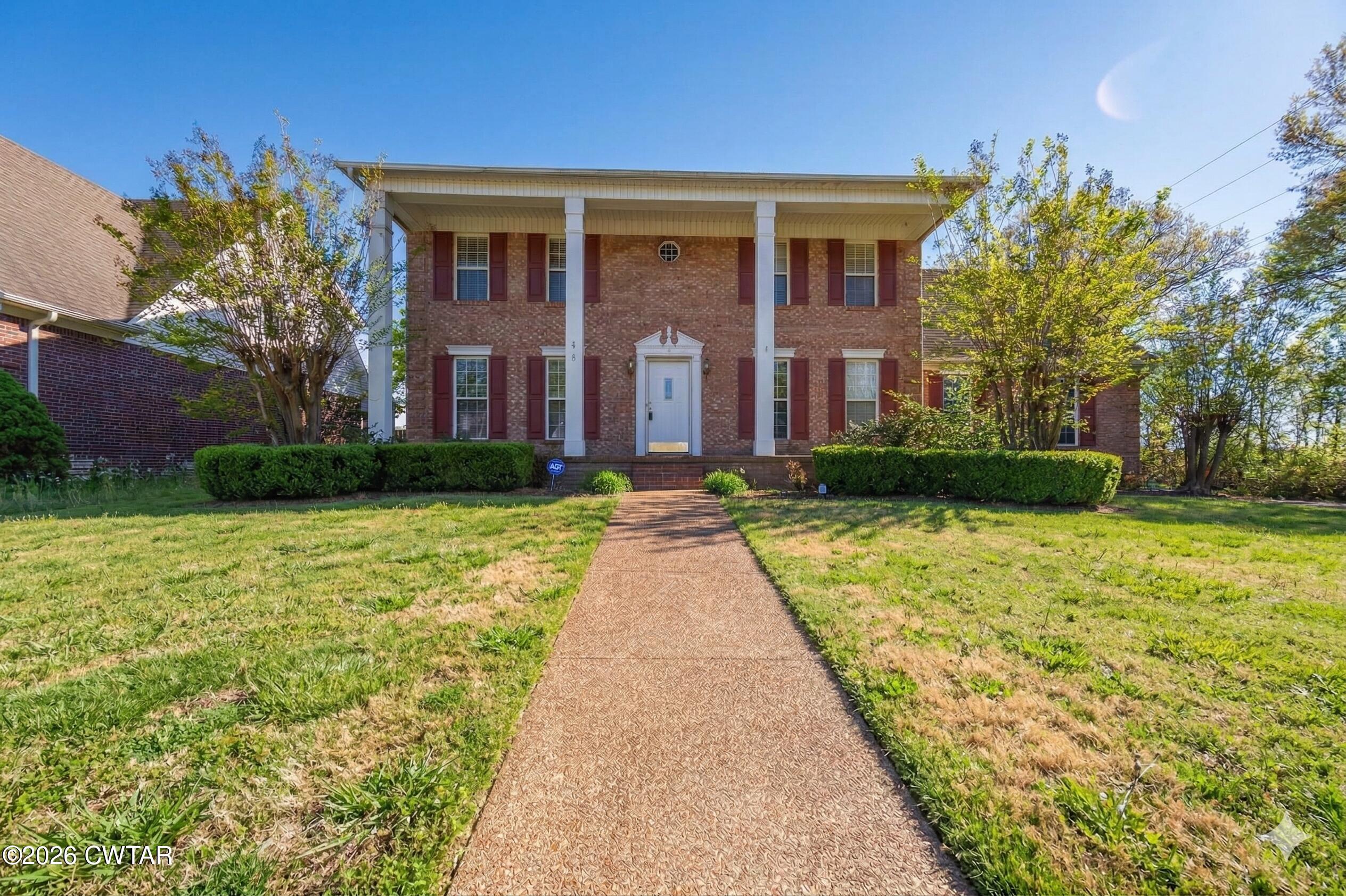 8 Sebastian Drive Jackson, TN 38305 - Photo 23 of 23 a front view of a house with garden
