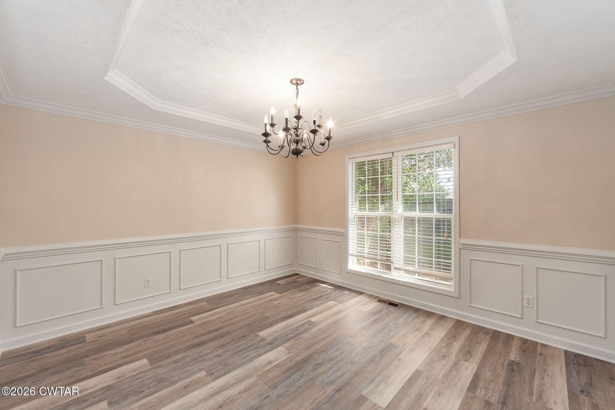 8 Sebastian Drive Jackson, TN 38305 - Photo 3 of 23 a view of an empty room with wooden floor and a window