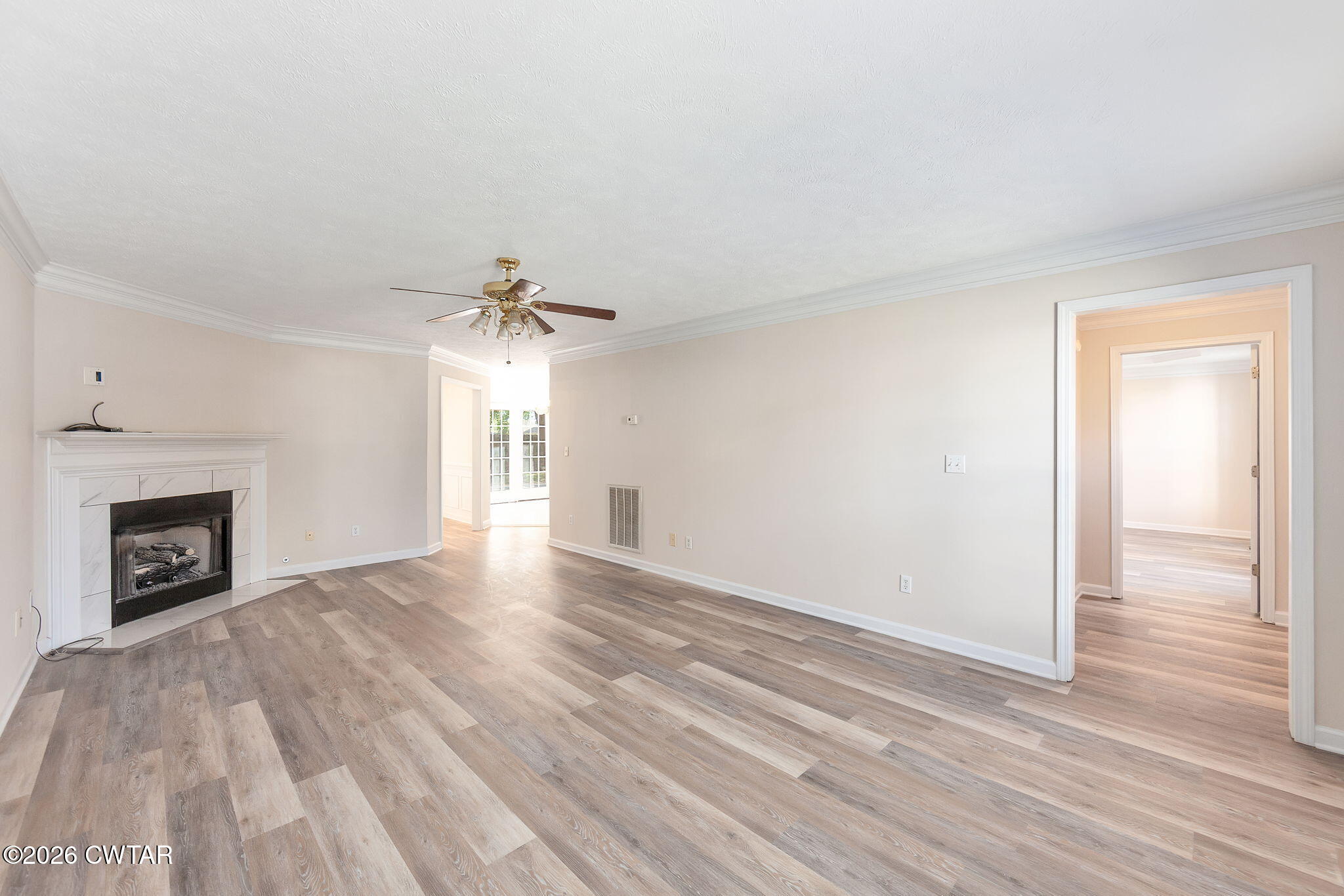 8 Sebastian Drive Jackson, TN 38305 - Photo 4 of 23 a view of empty room with wooden floor and fireplace