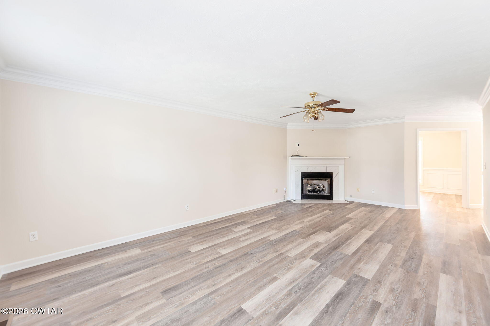 8 Sebastian Drive Jackson, TN 38305 - Photo 6 of 23 a view of a livingroom with a fireplace and a ceiling fan