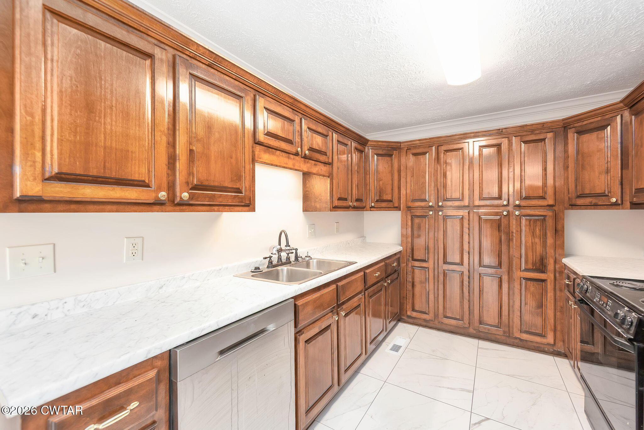 8 Sebastian Drive Jackson, TN 38305 - Photo 8 of 23 a kitchen with stainless steel appliances granite countertop a sink a stove and cabinets