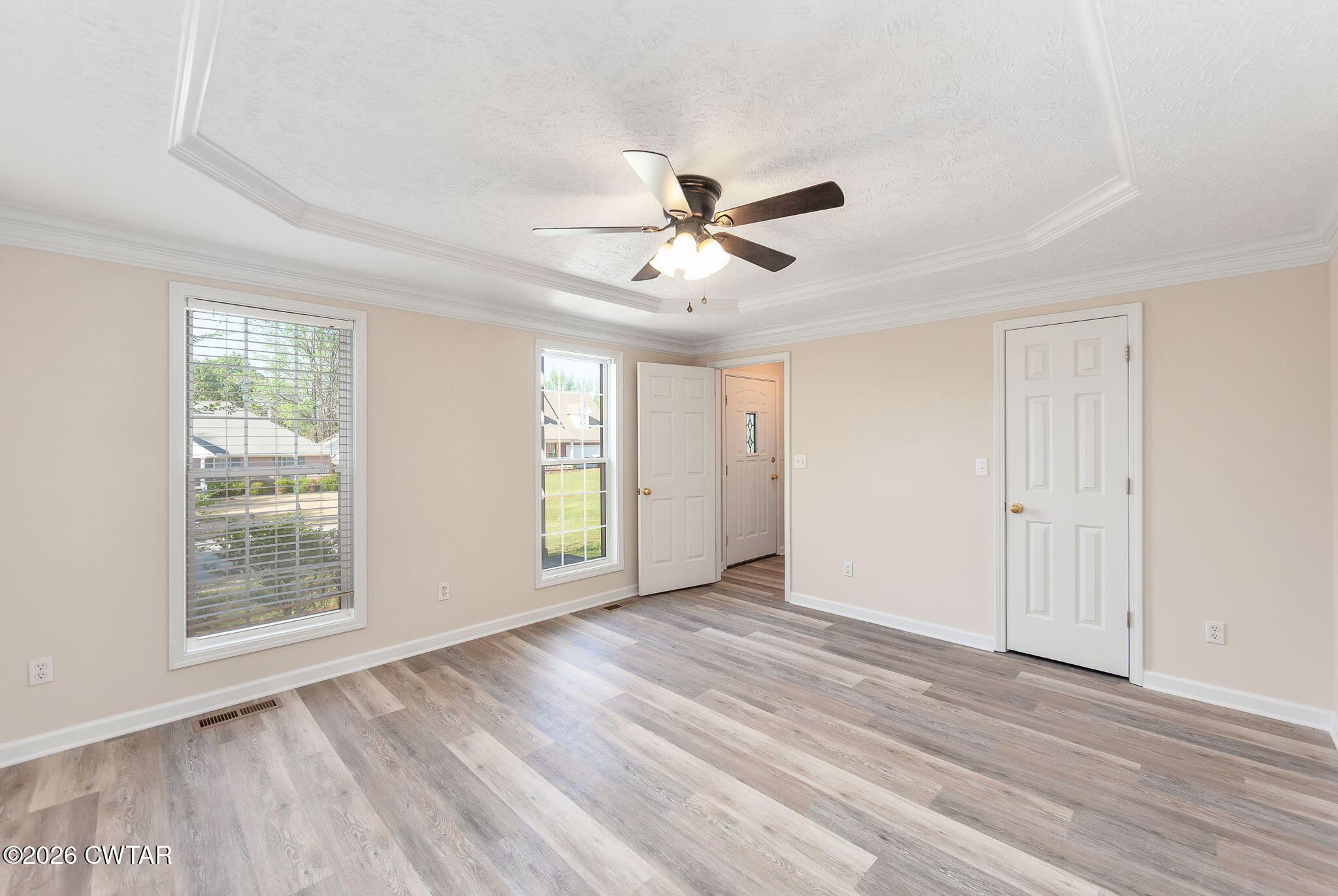 8 Sebastian Drive Jackson, TN 38305 - Photo 9 of 23 an empty room with wooden floor and windows