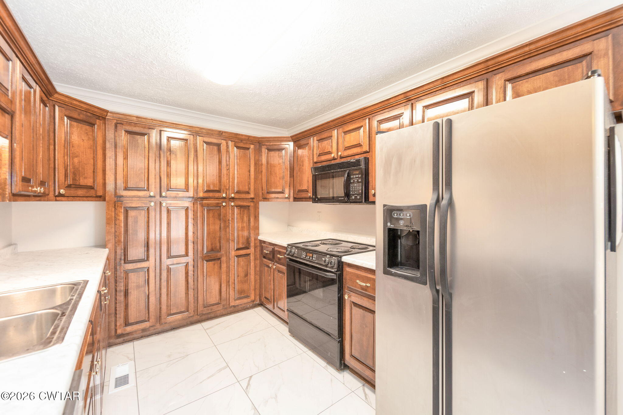 8 Sebastian Drive Jackson, TN 38305 - Photo 10 of 23 a kitchen with stainless steel appliances granite countertop a refrigerator and a stove top oven