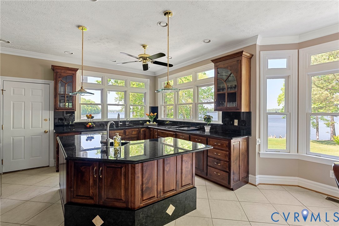 5213 Clipper Cove Road Midlothian, VA 23112 - Photo 19 of 73 The kitchen features dark wood cabinetry, a centra