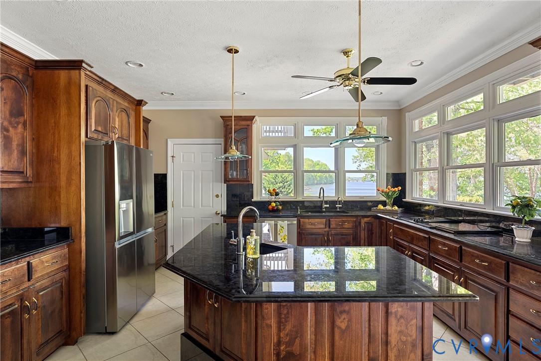 5213 Clipper Cove Road Midlothian, VA 23112 - Photo 20 of 73 This kitchen features rich wooden cabinetry, dark