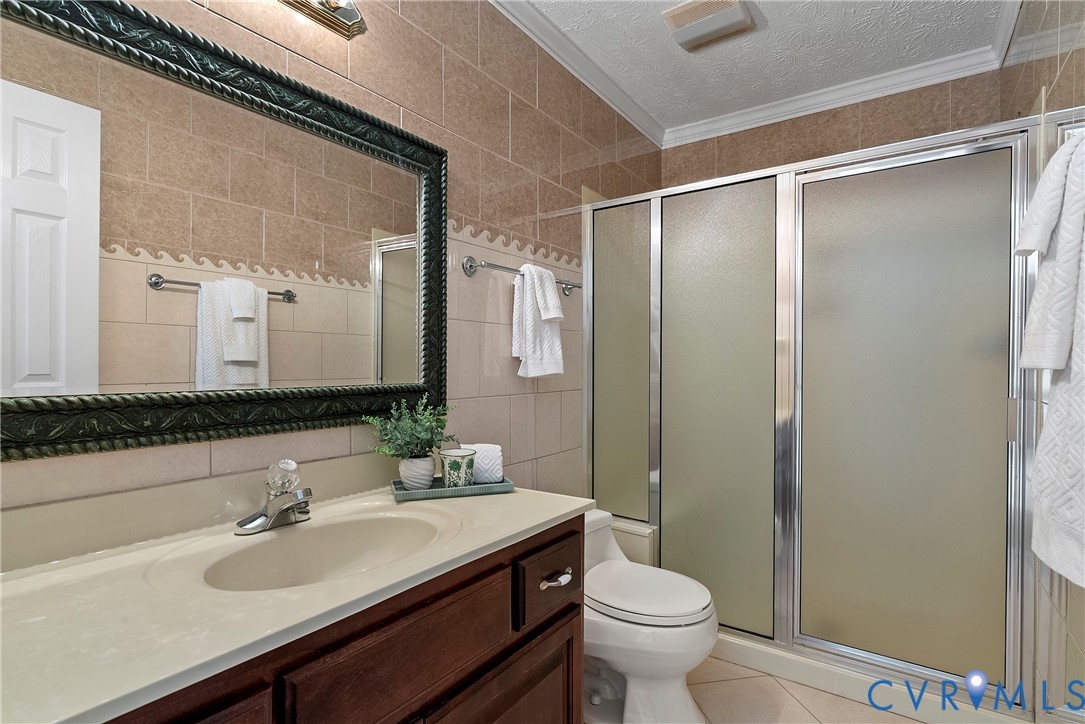 5213 Clipper Cove Road Midlothian, VA 23112 - Photo 29 of 73 The bathroom features a vanity with a light-colore