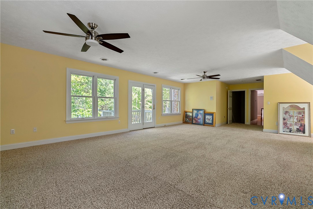 5213 Clipper Cove Road Midlothian, VA 23112 - Photo 33 of 73 Expansive room featuring light-colored carpet, mul