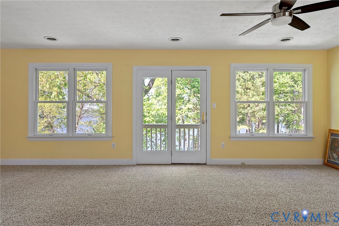 5213 Clipper Cove Road Midlothian, VA 23112 - Photo 34 of 73 This room features a neutral carpet, a ceiling fan