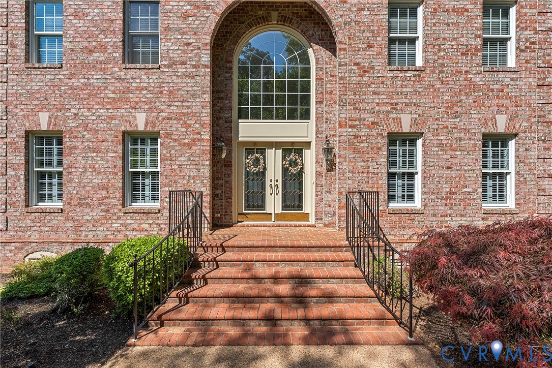 5213 Clipper Cove Road Midlothian, VA 23112 - Photo 5 of 73 The property features a brick exterior with a gran