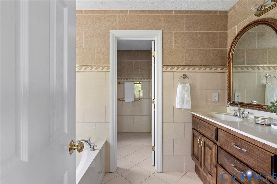 5213 Clipper Cove Road Midlothian, VA 23112 - Photo 51 of 73 Bathroom featuring a double vanity with wood cabin