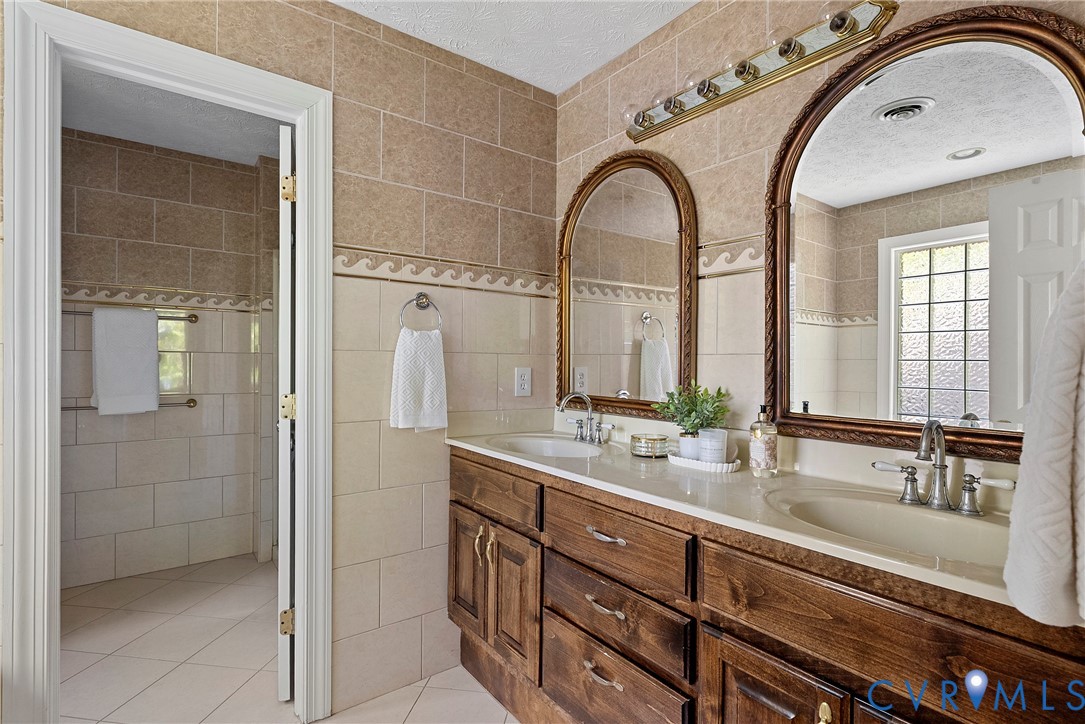 5213 Clipper Cove Road Midlothian, VA 23112 - Photo 52 of 73 The bathroom features a double vanity with wooden