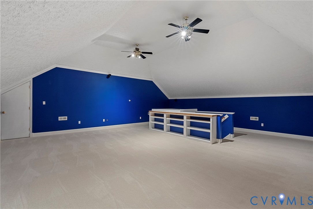 5213 Clipper Cove Road Midlothian, VA 23112 - Photo 58 of 73 Expansive bonus room featuring sloped ceilings, tw