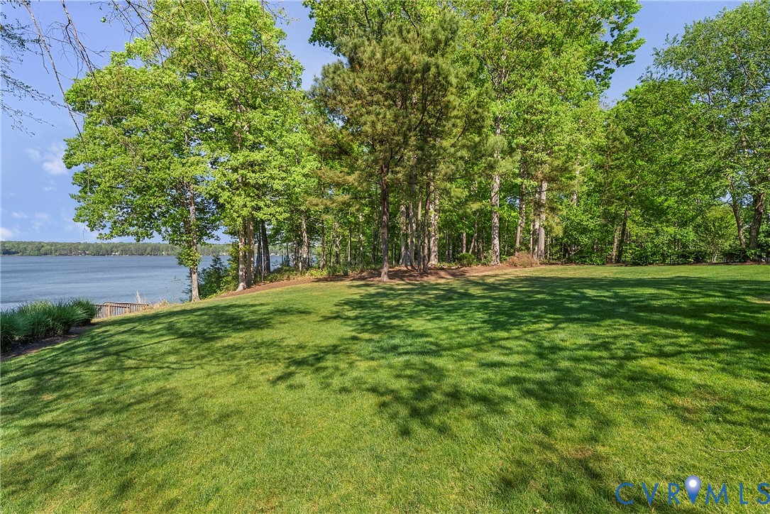 5213 Clipper Cove Road Midlothian, VA 23112 - Photo 62 of 73 Expansive grassy yard with mature trees and a scen