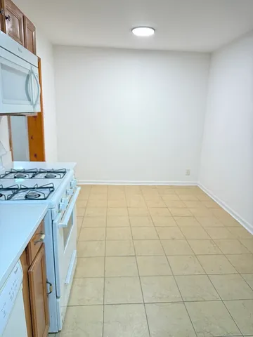 a kitchen that has a sink and a stove
