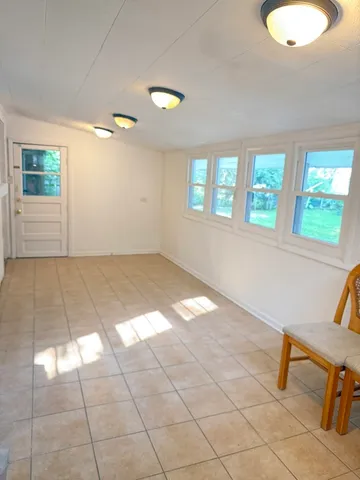 a view of a livingroom with a lounge chair