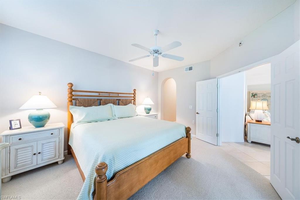 7120 Timberland Circle, Unit 101 Naples, FL 34109 - Photo 13 of 24 a bedroom with bed and window