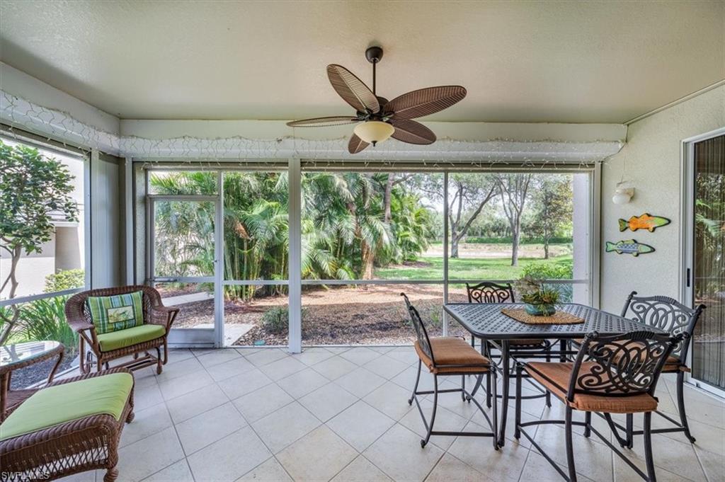 7120 Timberland Circle, Unit 101 Naples, FL 34109 - Photo 19 of 24 a dining room with furniture and a floor to ceiling window